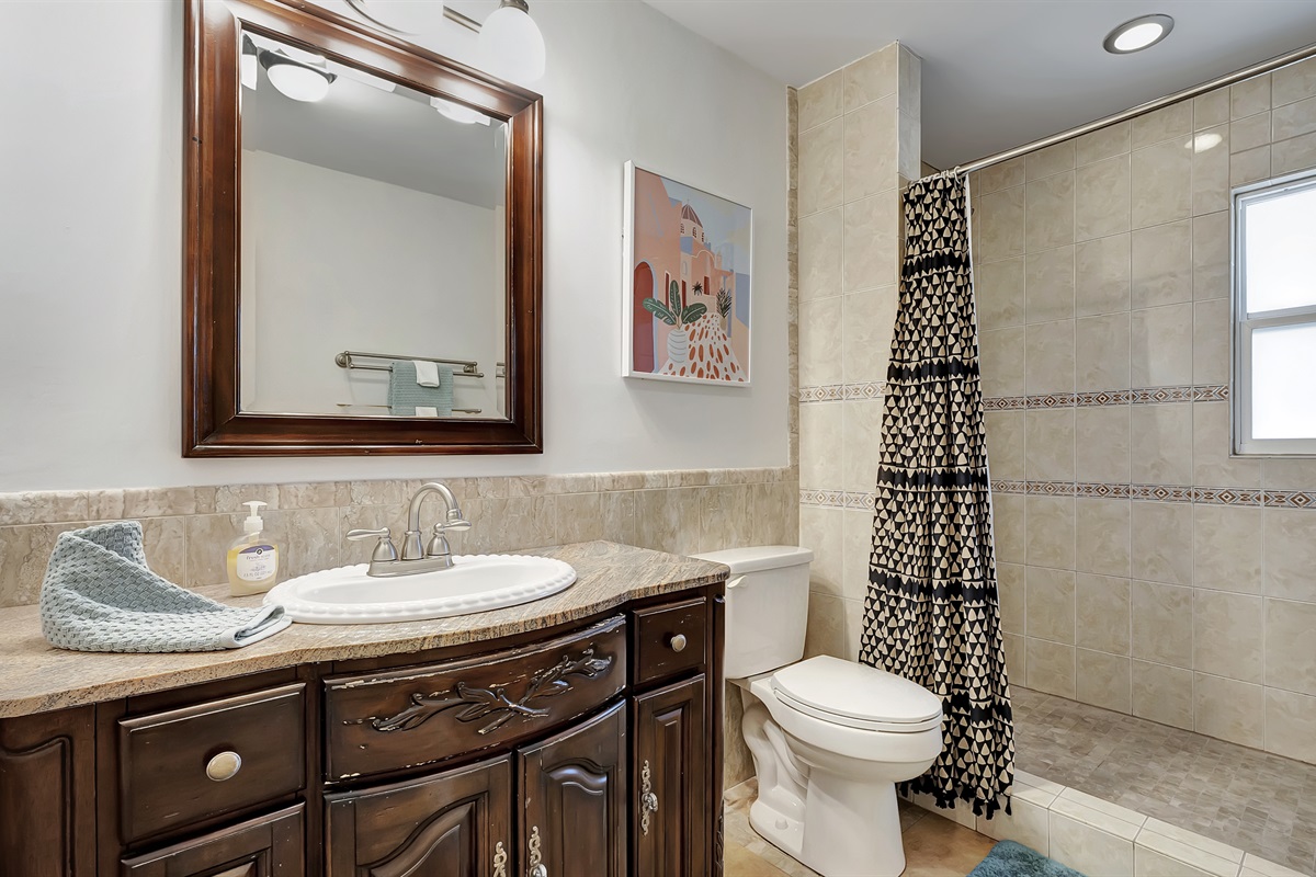 We love the wooden accents in this bathroom