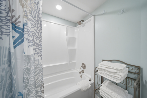 Bathtub with fresh towels ready for your stay
