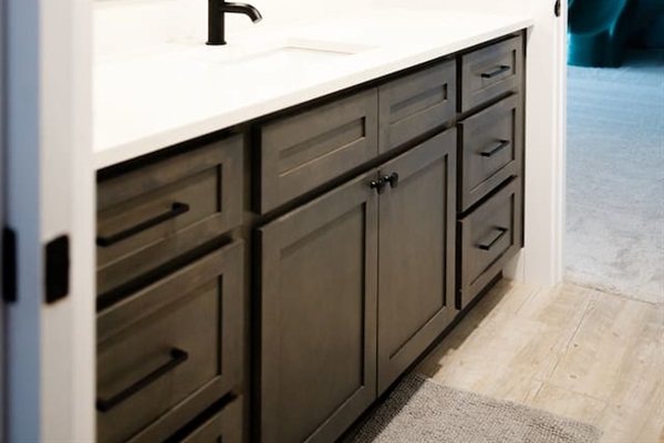Private sink area for bedroom #2, which connects via sliding doors to private toilet room and private shower room (shared with bedroom #3).