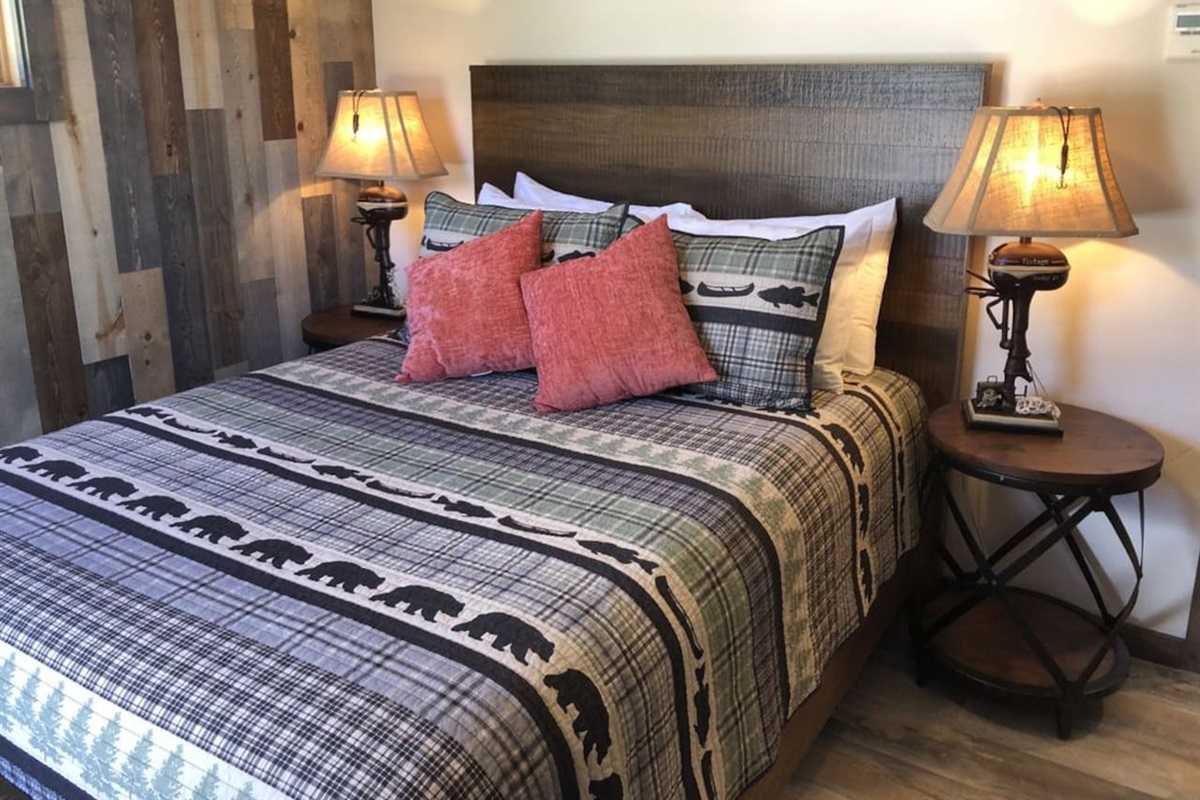 Queen sized bed. Luggage rack and closet with hangers. 