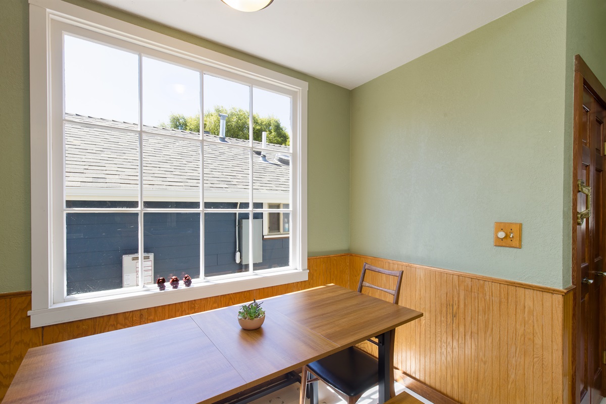 Kitchen dining area with table and window