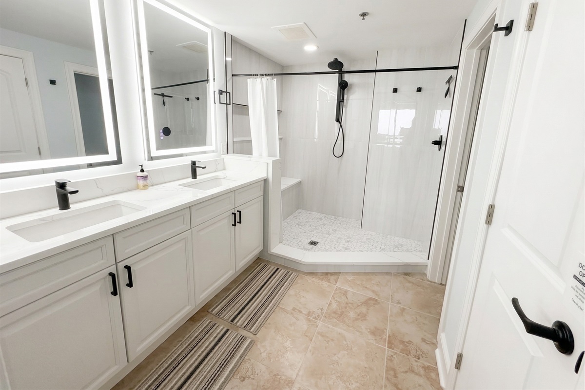 Start your day with plenty of space—double sinks, bright lighting, and a large walk-in tiled shower make mornings easy for everyone.
