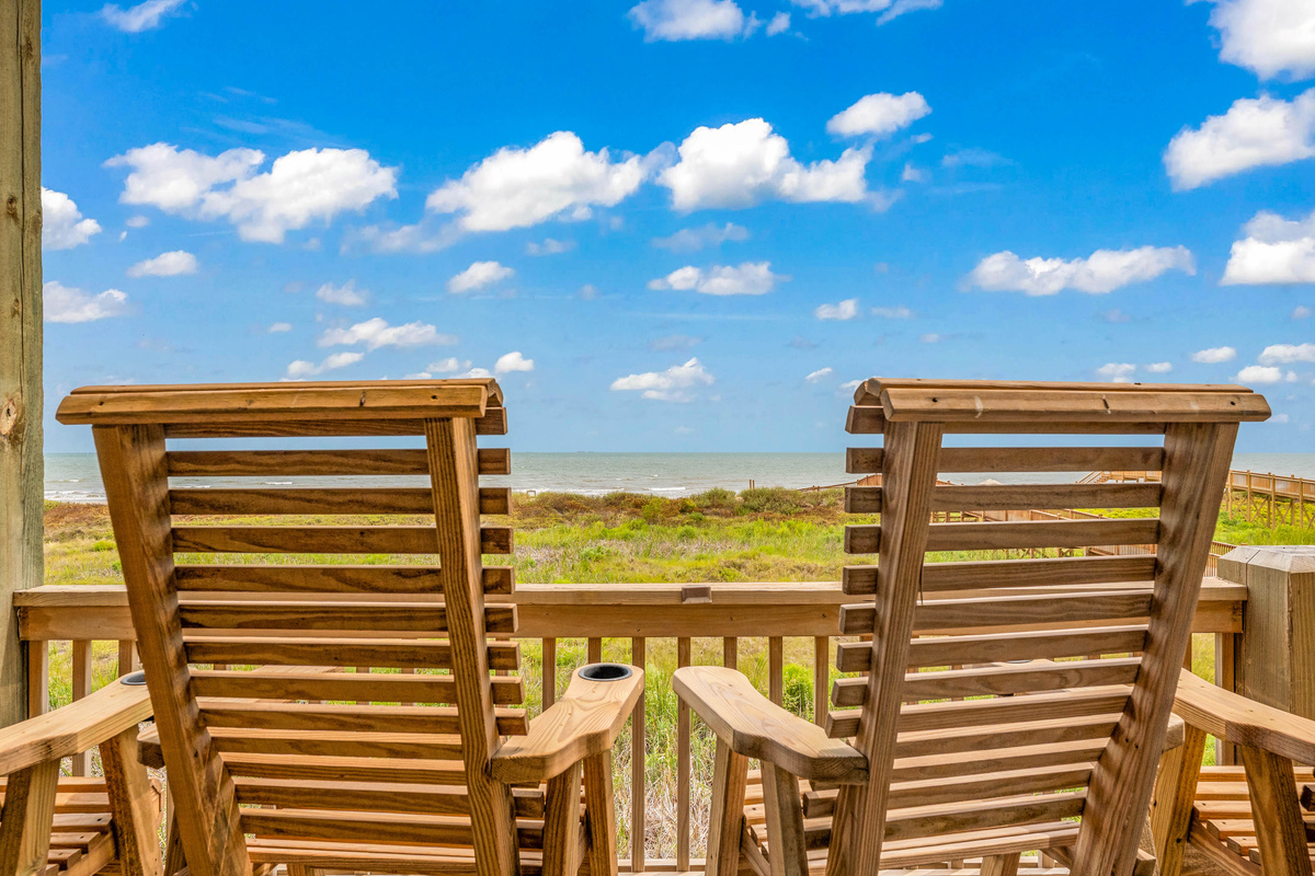 Cair Paravel: Rows of wooden porch chairs line the massive covered deck, pull one up and watch the waves roll in.