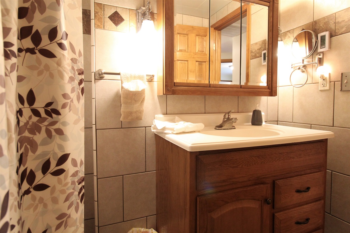 Bathroom is fully tiled with a heated floor