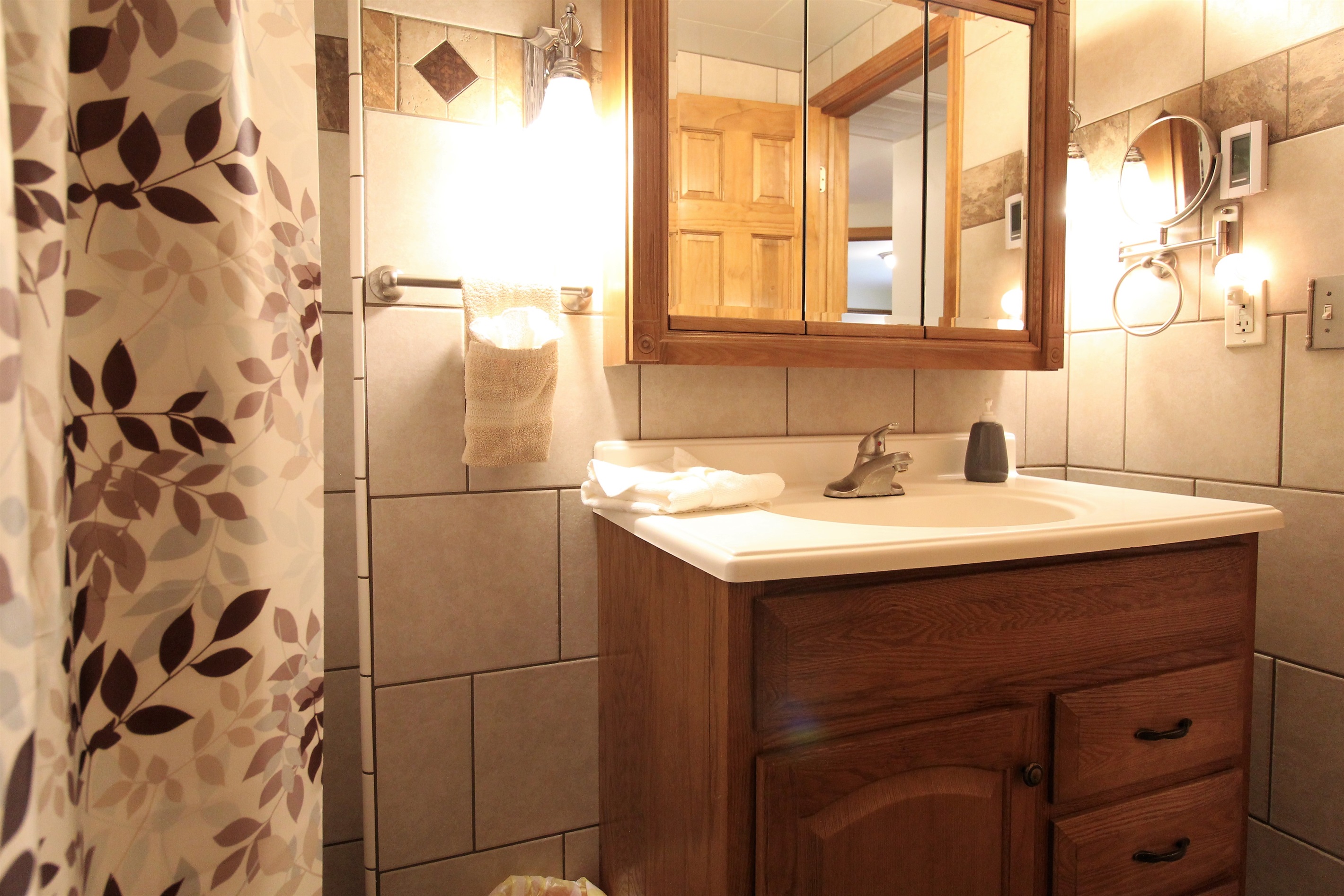 Bathroom is fully tiled with a heated floor