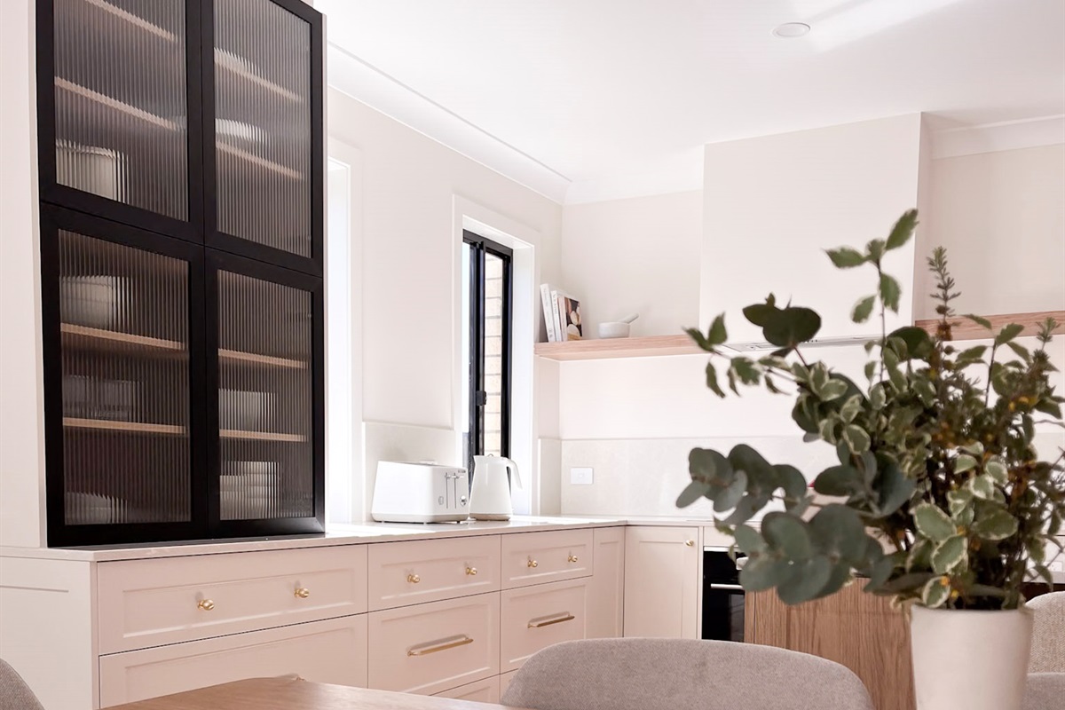 The kitchen cupboard adds practical storage beside the main bench, keeping the cooking zone organised and easy to use.