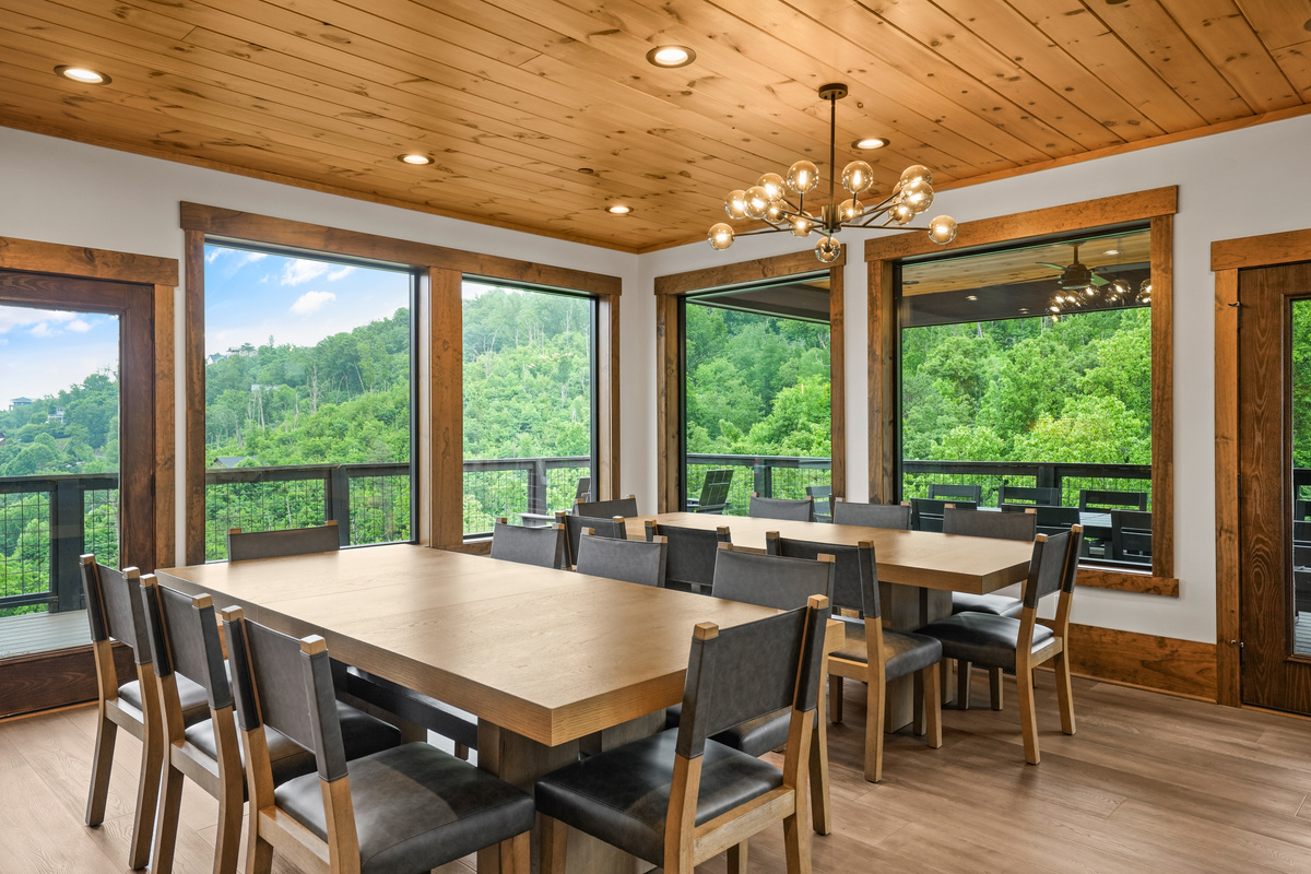 Enjoy unforgettable meals in a bright, open dining space featuring panoramic mountain views, elegant lighting, and plenty of room for your entire group to gather and connect.