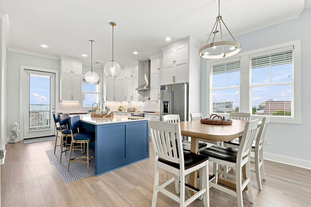 Gather, cook, and enjoy time together in this bright open-concept kitchen and dining space designed for effortless vacation living