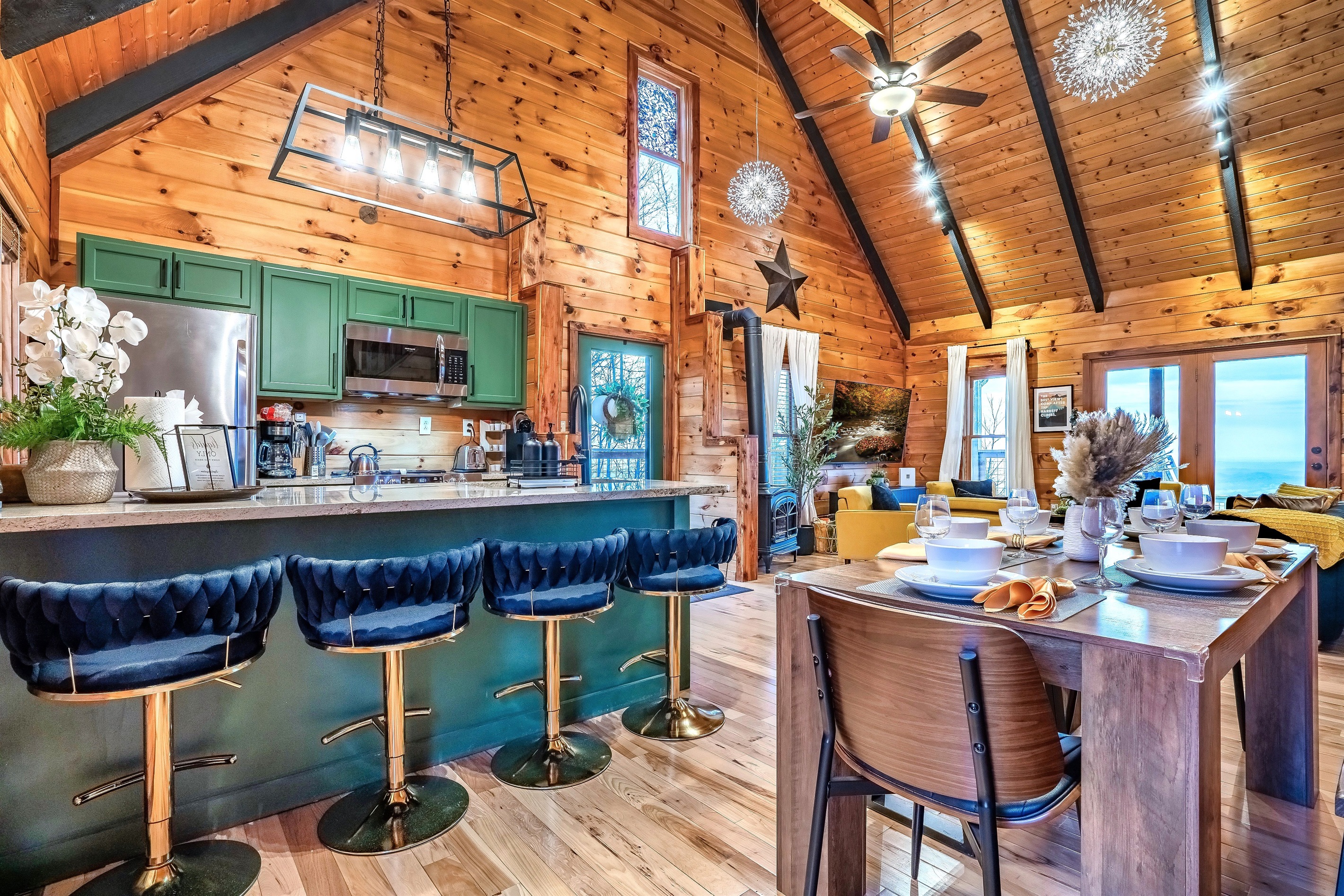 A warm and inviting dining space with family-style table and countertop seating, designed for comfort, connection, and enjoying the peaceful mountain ambiance.