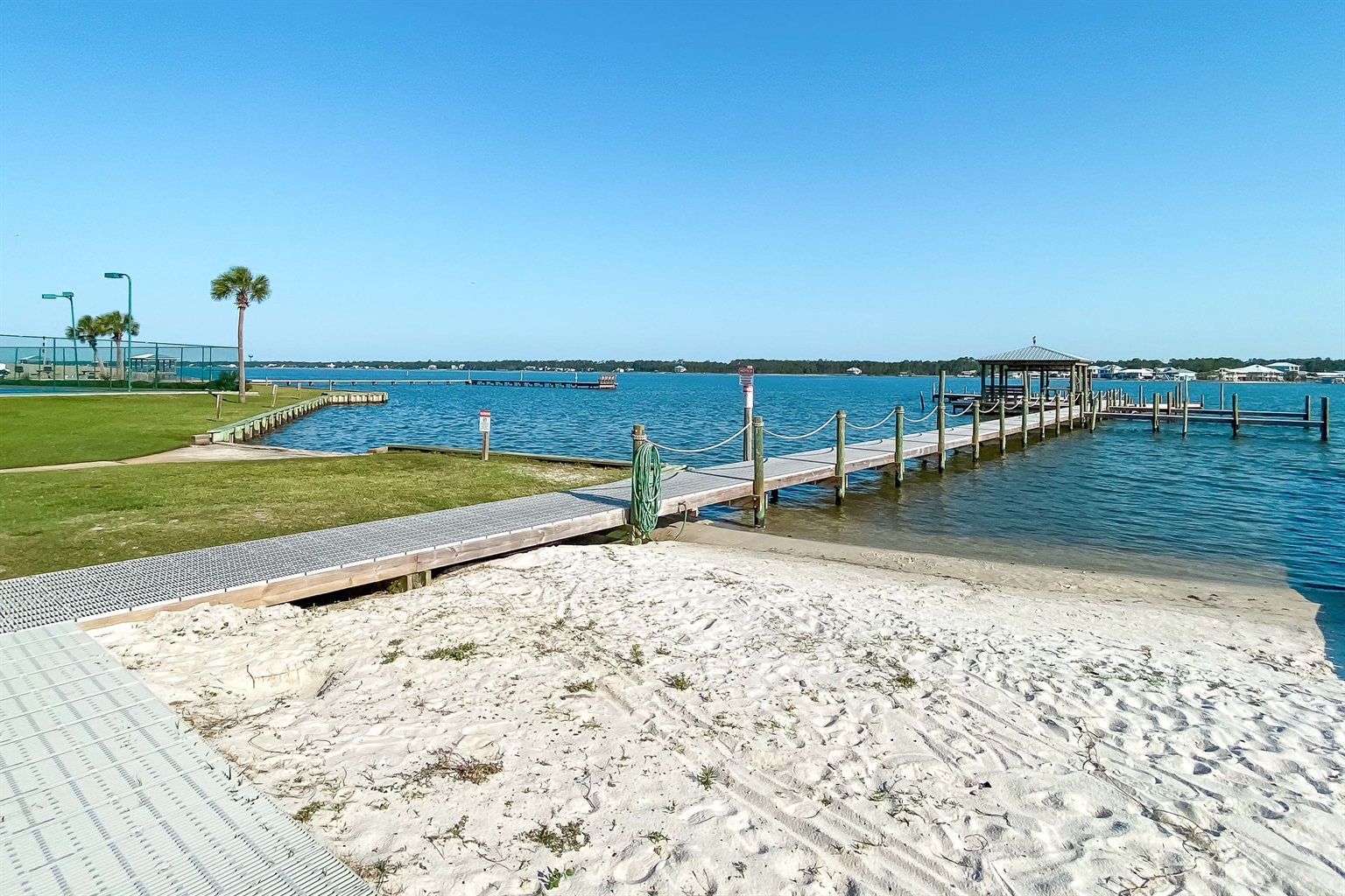 Experience the best of Gulf Shores! Our condo at Gulf Shores Surf and Racquet Club offers exclusive private beach access on the Gulf and a private boat dock on Little Lagoon.
