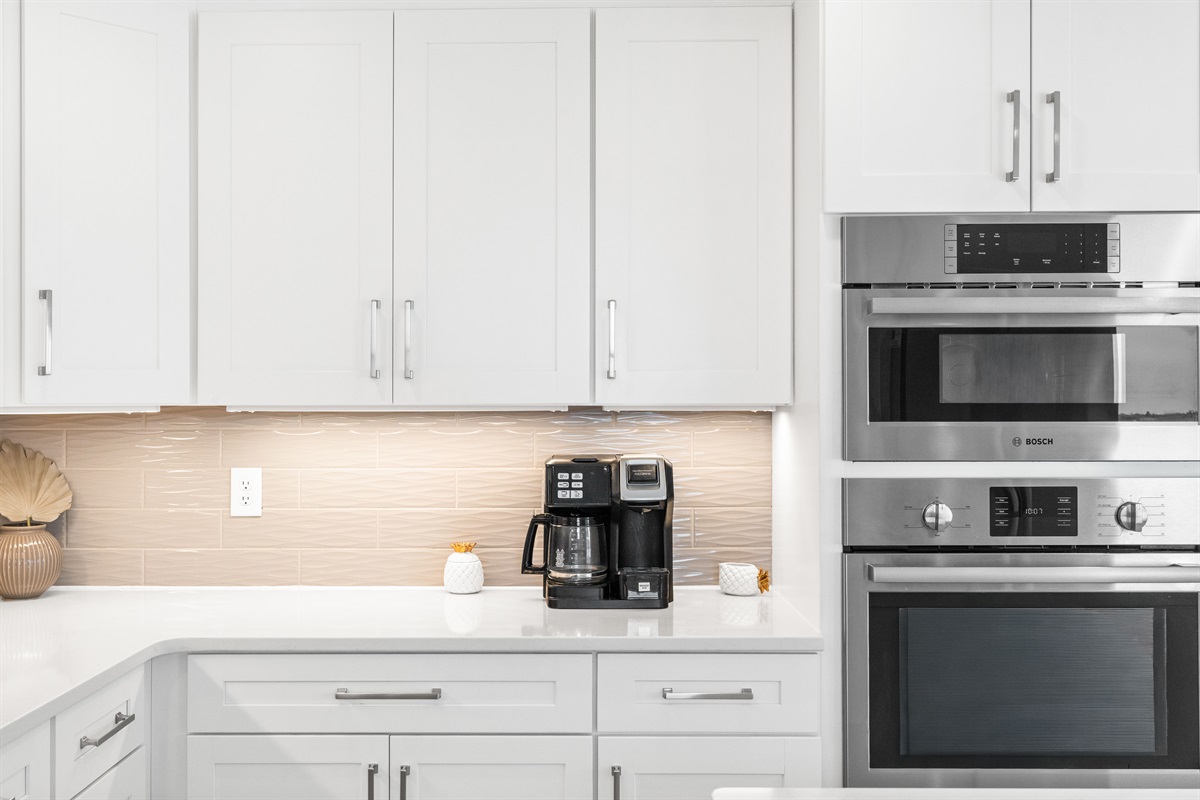 Enjoy thoughtful touches throughout including a coffee station and abundant counter space for your morning routine