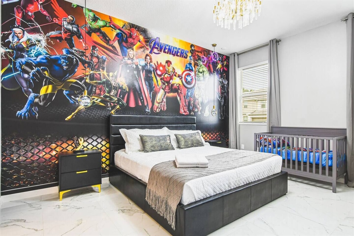 Rest easy in this cozy king bedroom with an ensuite, thoughtfully equipped with a crib for the ultimate family-friendly retreat.