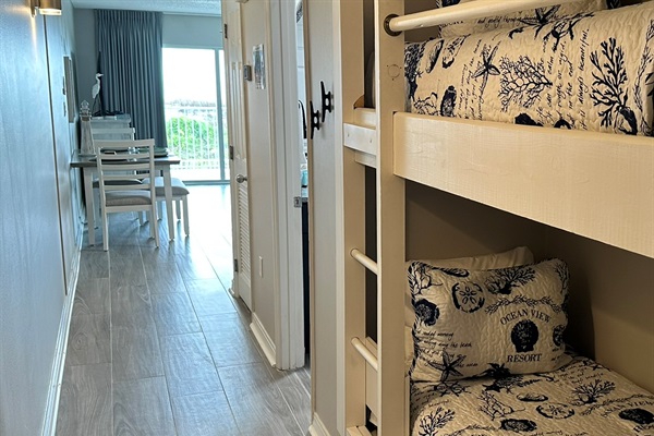Built-in hallway bunks paired with stylish new tile