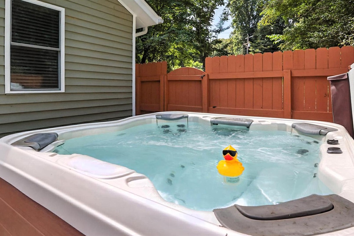 Hot Tub Retreat: Soak in relaxation with a charming view and playful vibes from our rubber duck!