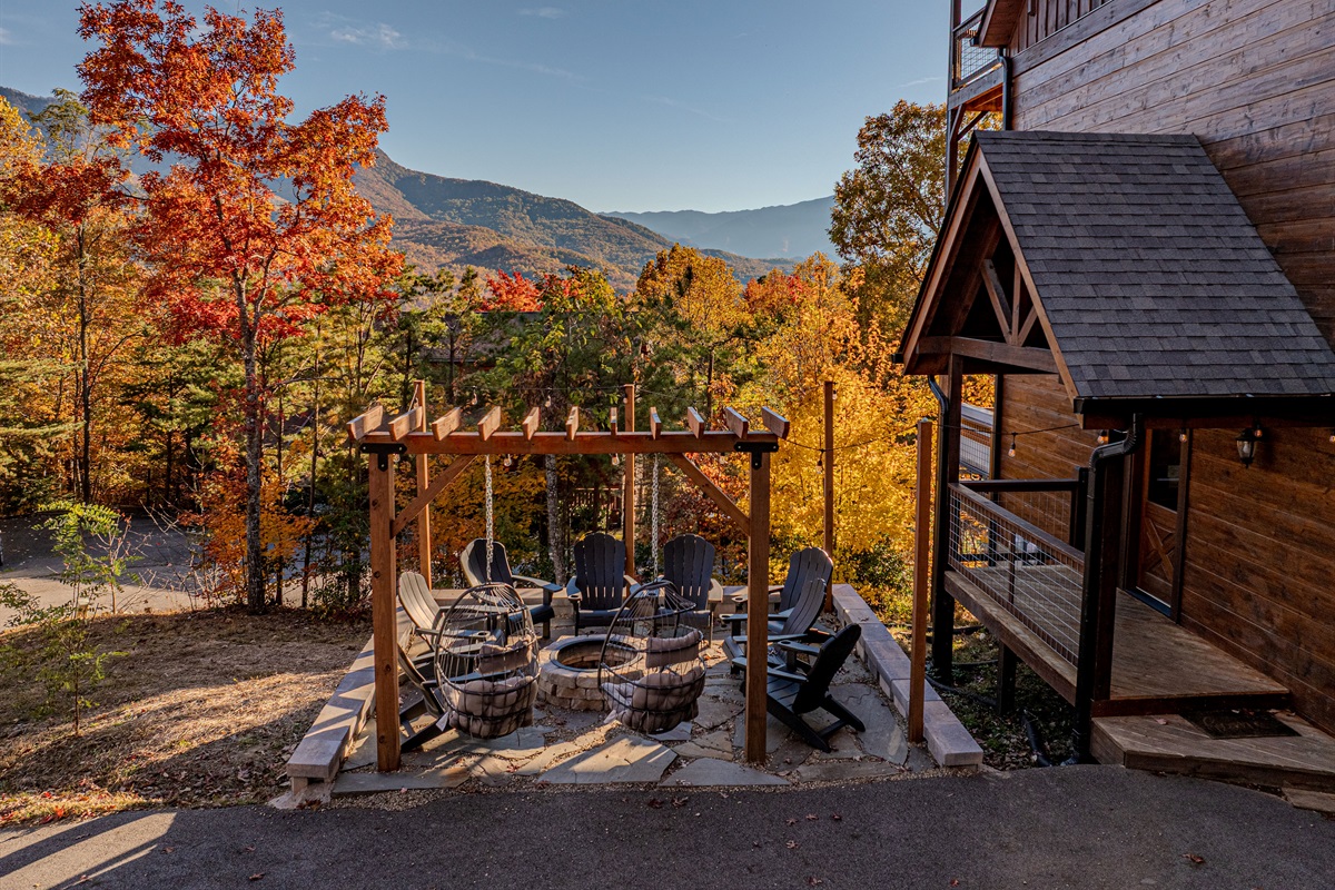 Relax with friends under the pergola with panoramic mountain views.