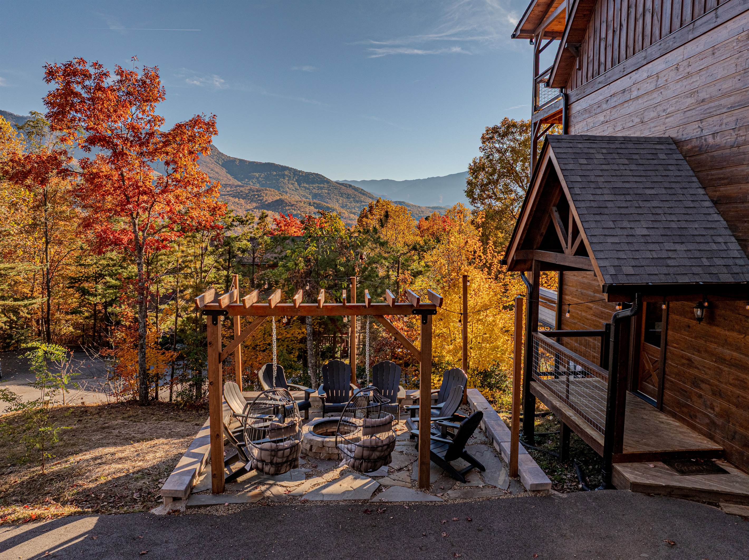 Relax with friends under the pergola with panoramic mountain views.