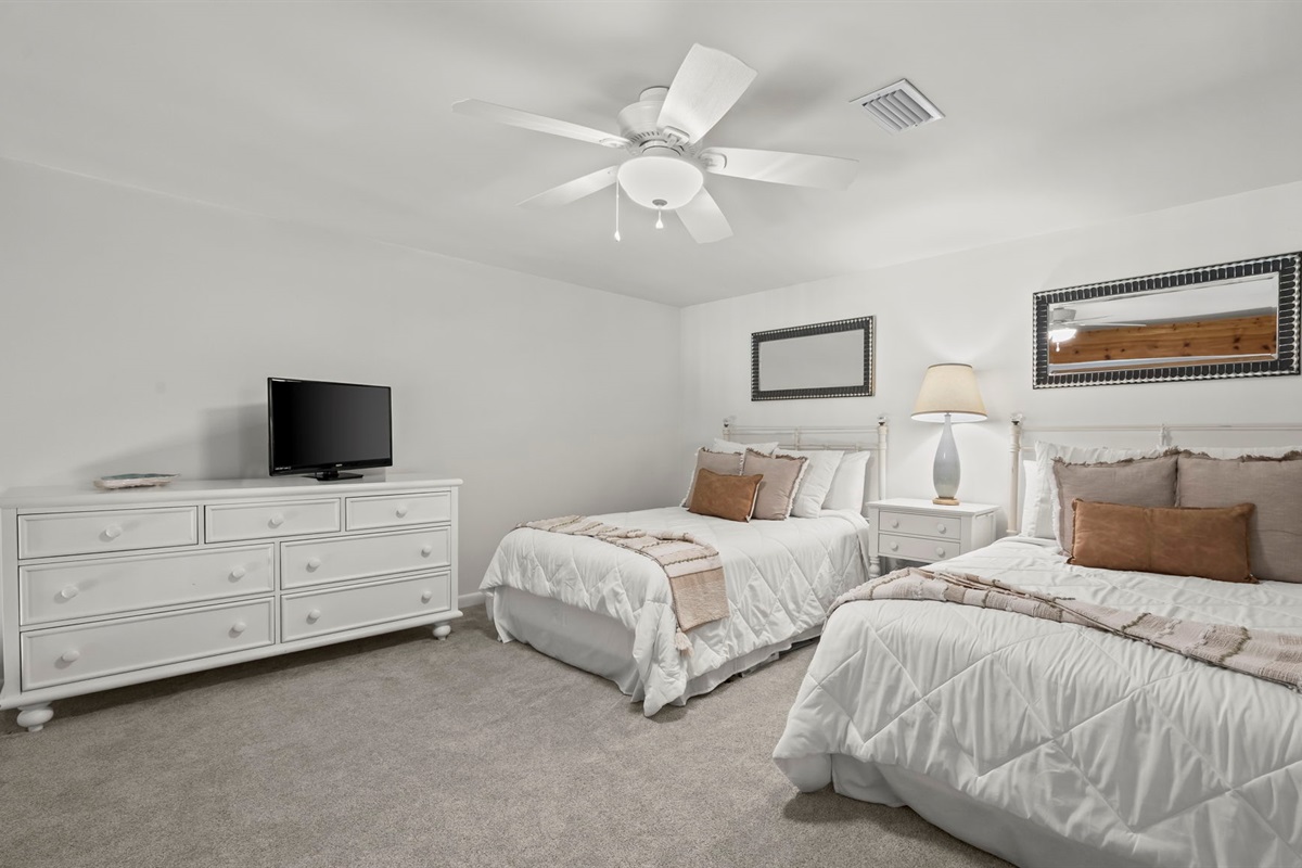 Spacious and inviting, the guest loft in our Cotton Bayou condo features two double beds, offering plenty of room for family or friends. This cozy retreat is perfect for relaxing after a day at the pool or exploring the bay.