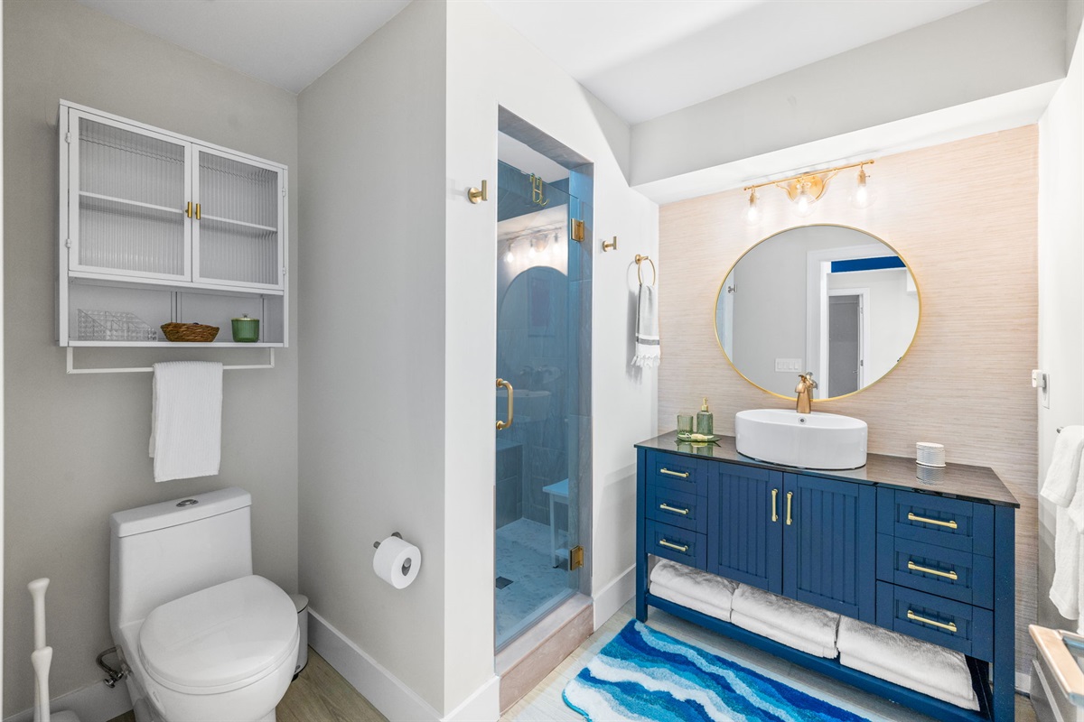 This is the shared full bathroom for the two downstairs bedrooms—the queen with trundle and the bunk bed room. The walk-in shower is truly stunning and spacious, though the photo doesn’t quite capture its full beauty!
