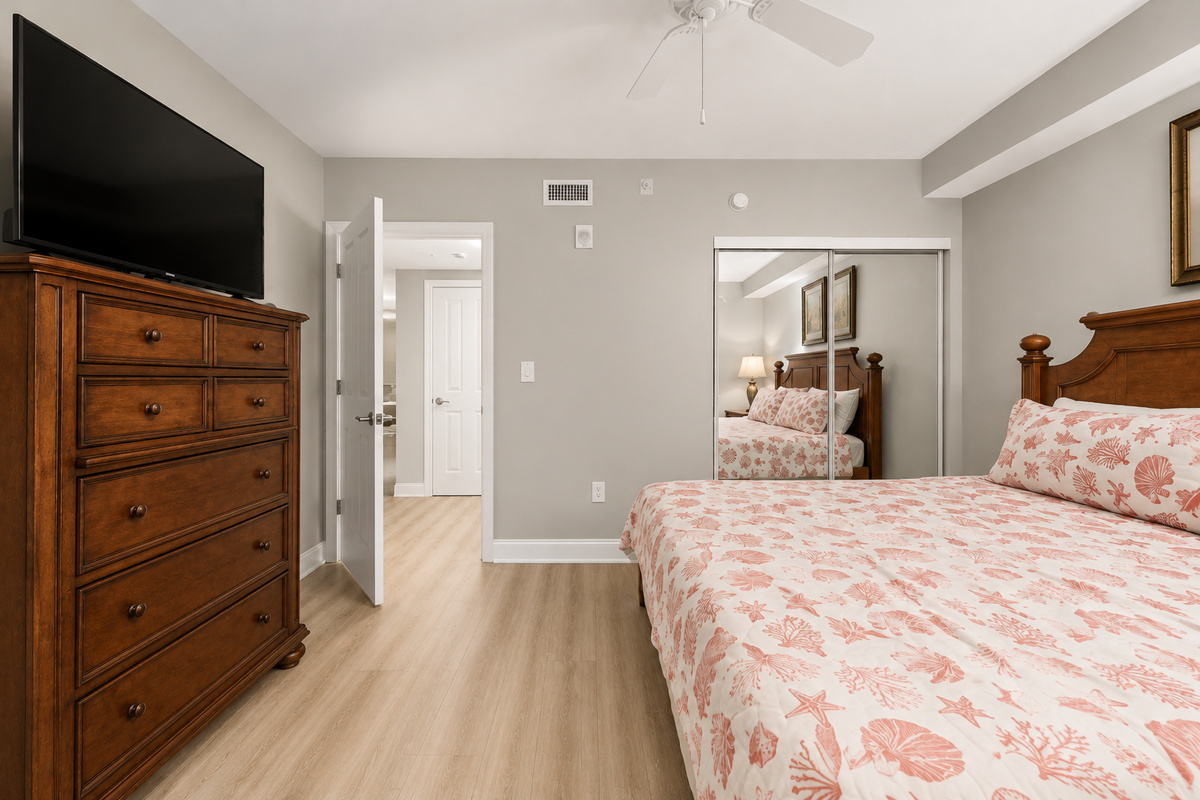 Second bedroom with smart TV and king bed.