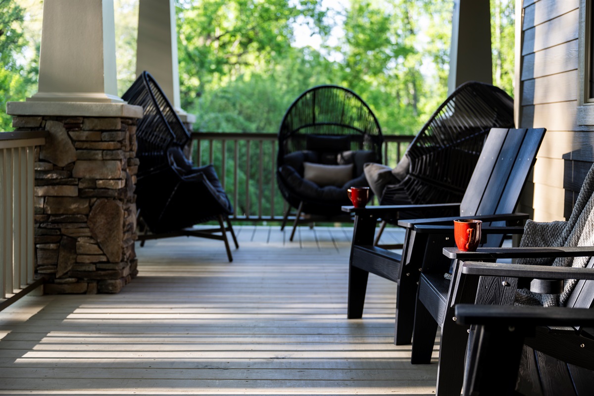 Gather with family and friends on the expansive wrap-around porch featuring cozy seating nooks and wooded views. From morning coffee to late-night laughs, this is where the best conversations unfold.
