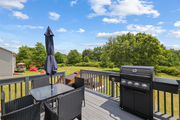 Let the designated BBQ master work their magic on the grill.