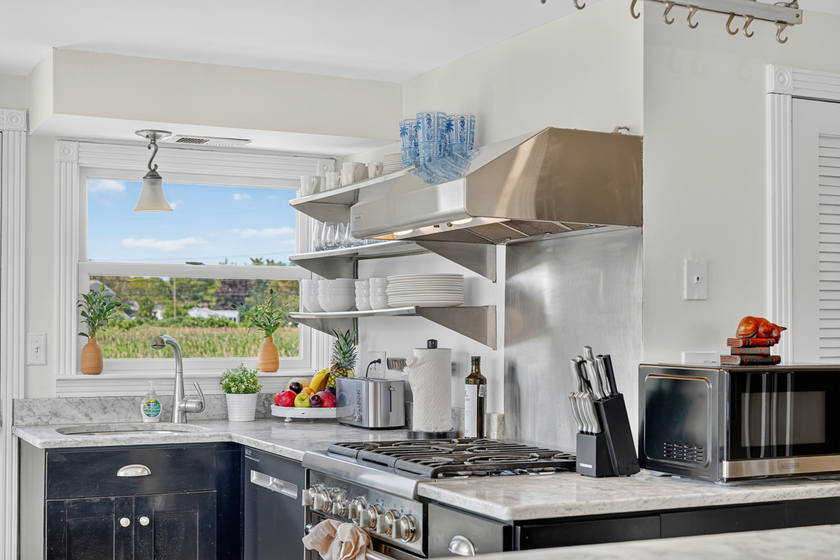 Well-equipped kitchen with modern appliances and stunning ocean views to inspire every meal.