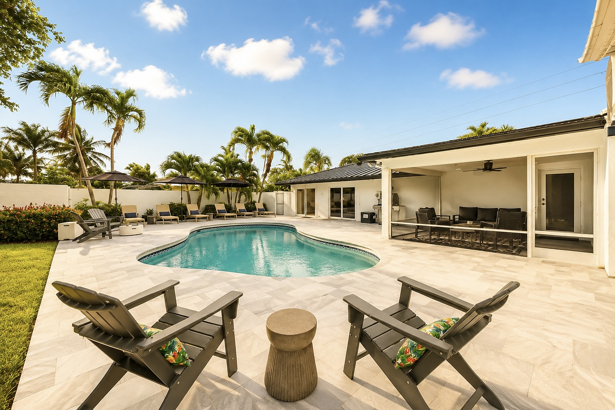 Pull up a chair by the fire pit area, with the pool, cornhole, and shaded backyard nearby for relaxed outdoor time.