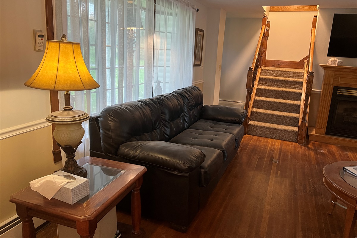 Living room with stairs to 2nd floor