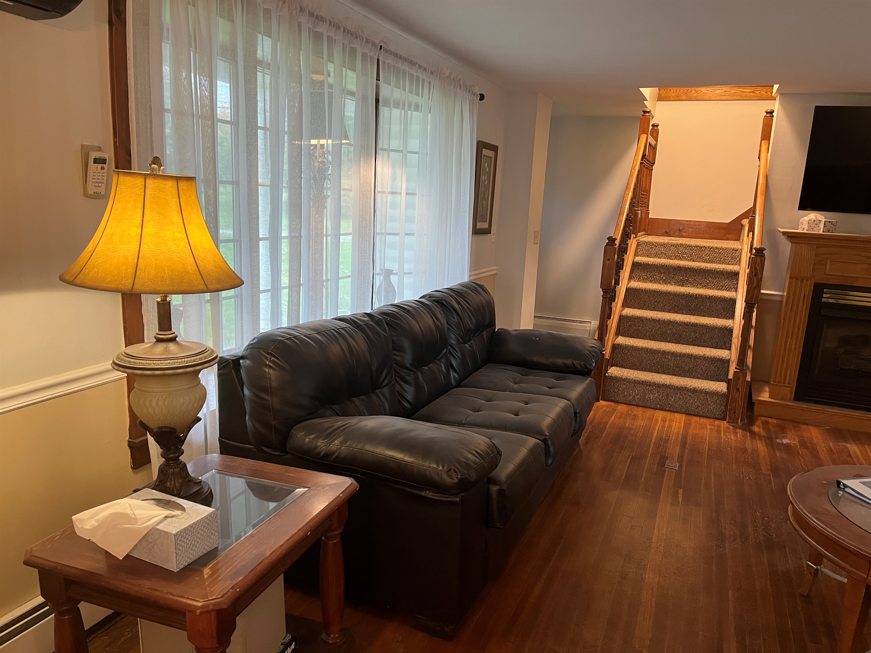 Living room with stairs to 2nd floor