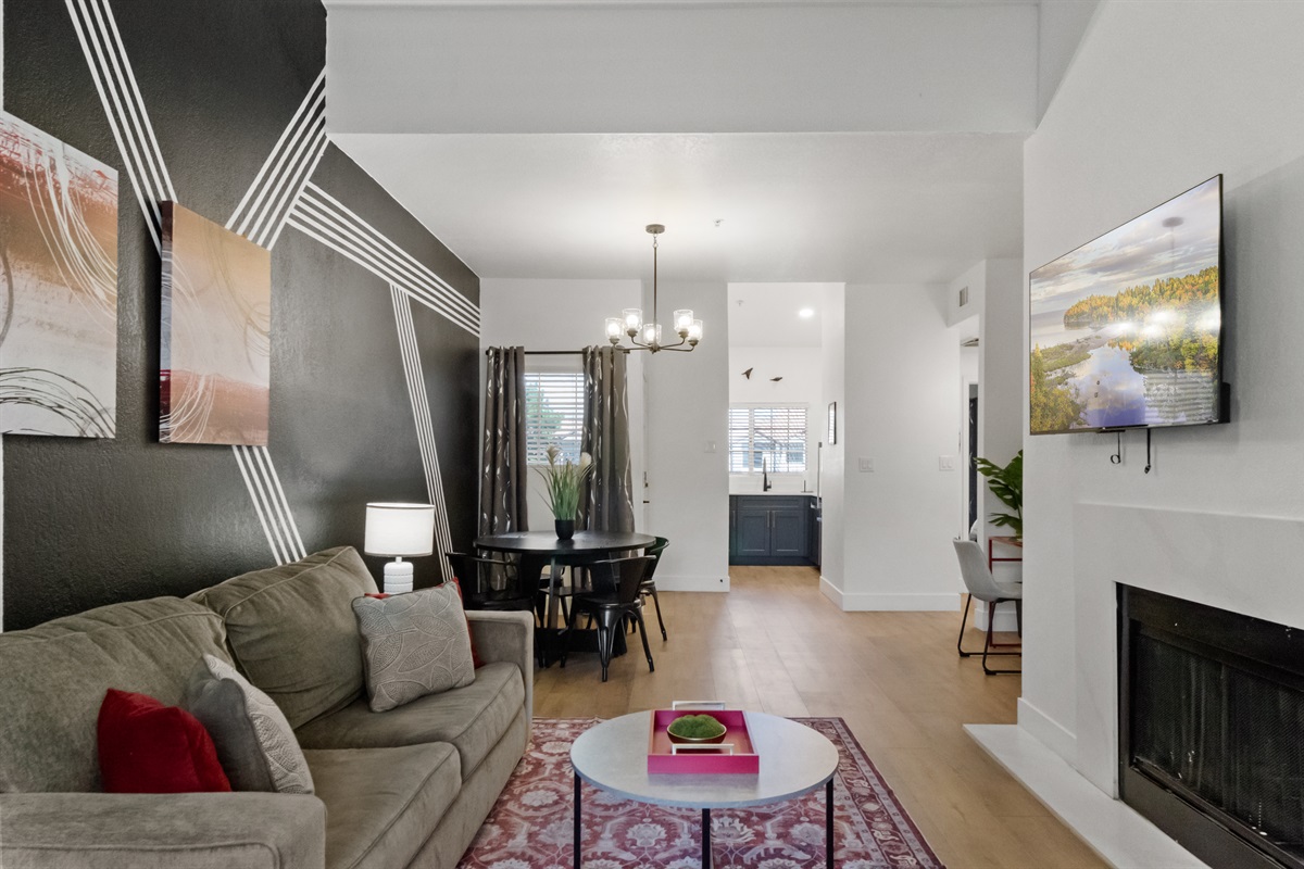 Relax and unwind in the inviting living room space with fireplace
