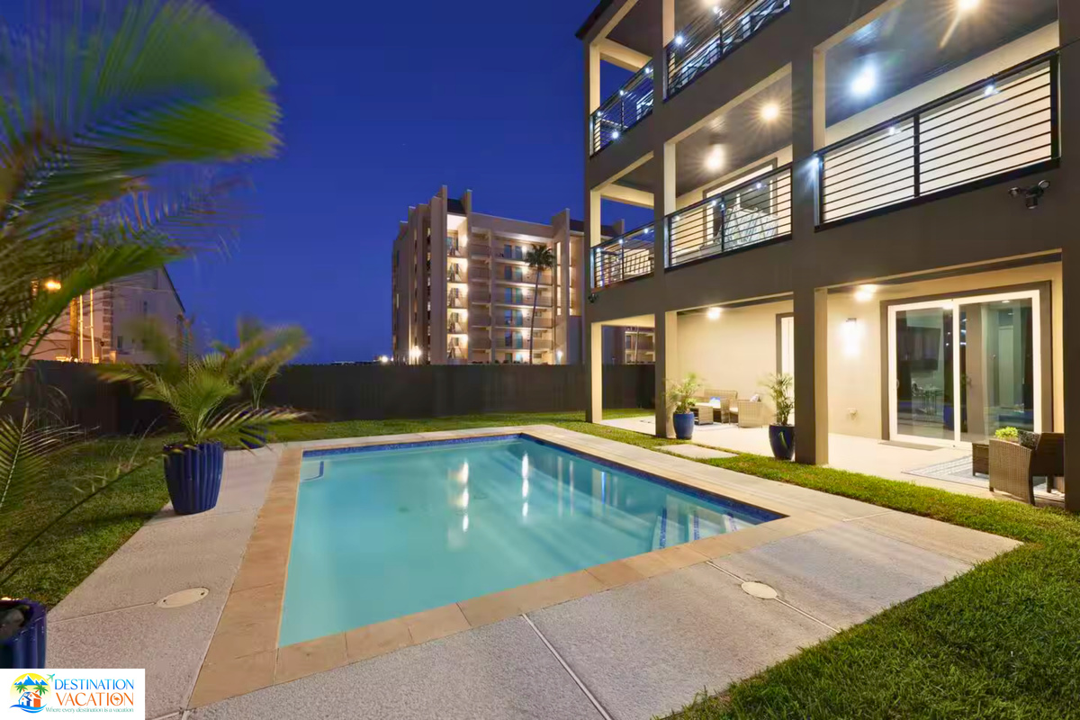 Private poolside paradise awaits beneath sunny coastal skies.