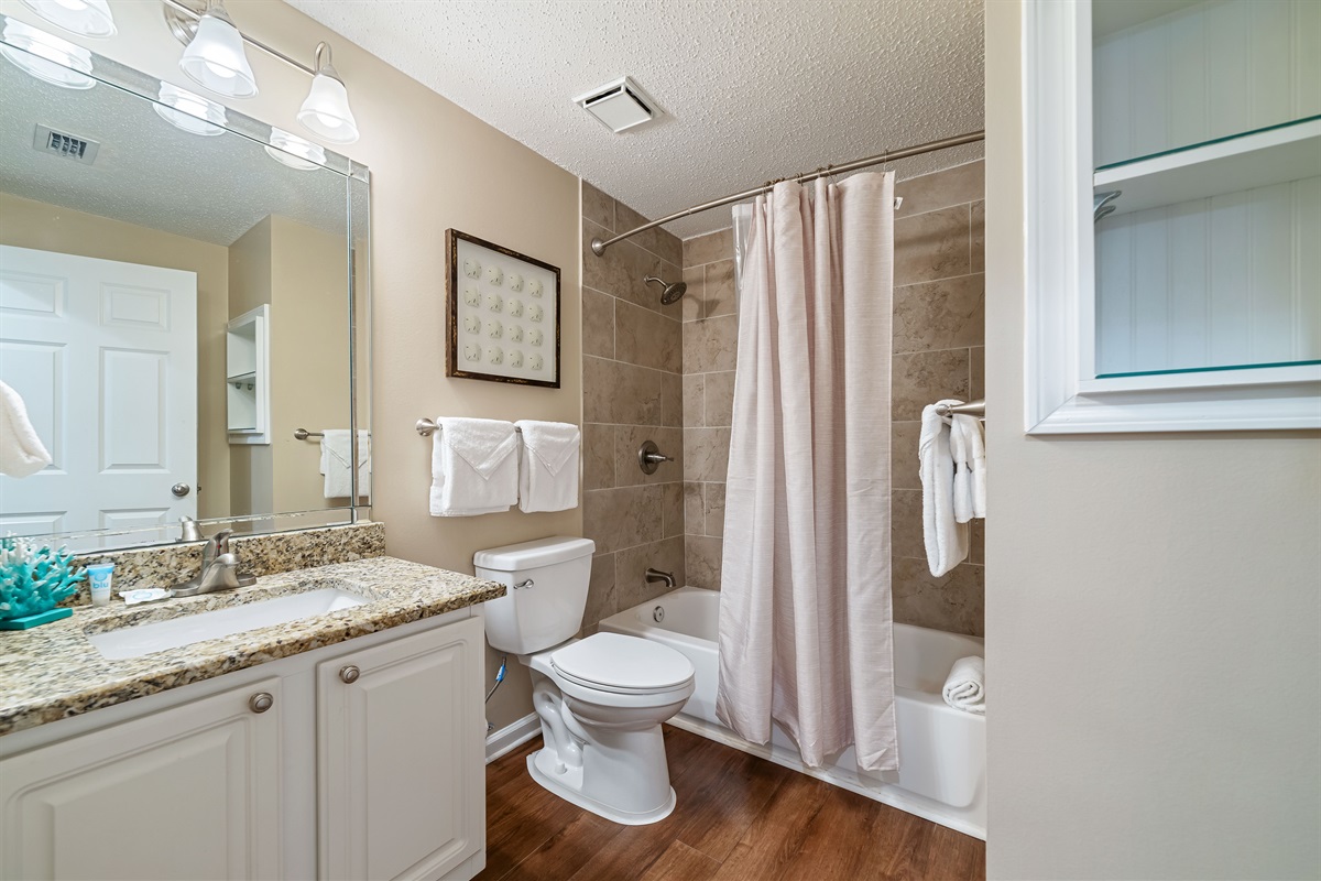 Modern updates meet classic comfort in this bathroom.  Clean lines and thoughtful design provide a relaxing experience.