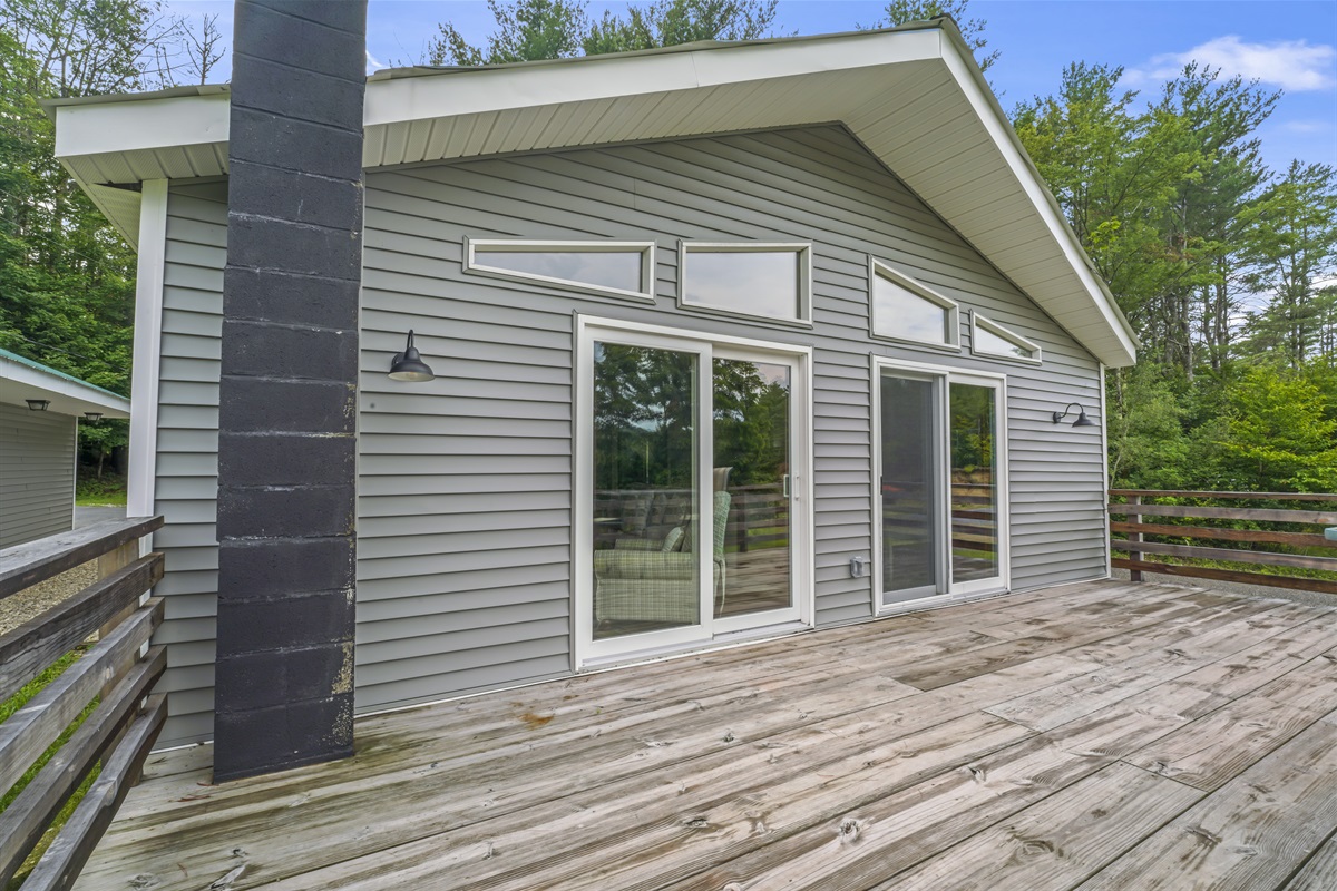 Balcony off of side of house