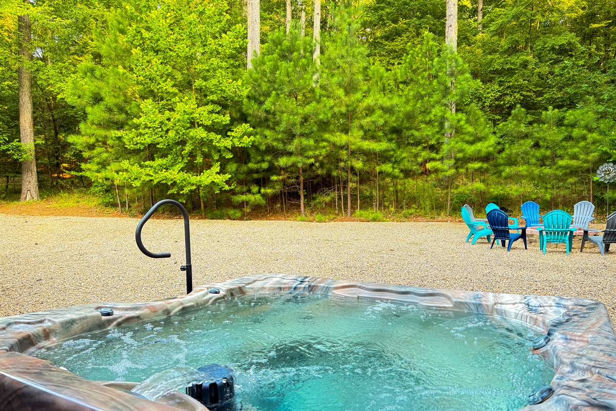 Soak under the trees in your own secluded spa.