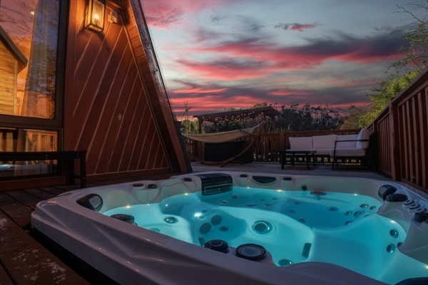 Private hot tub on the deck with sunset views over the Smoky Mountains. Unwind under the stars after a day on the lake, a romantic