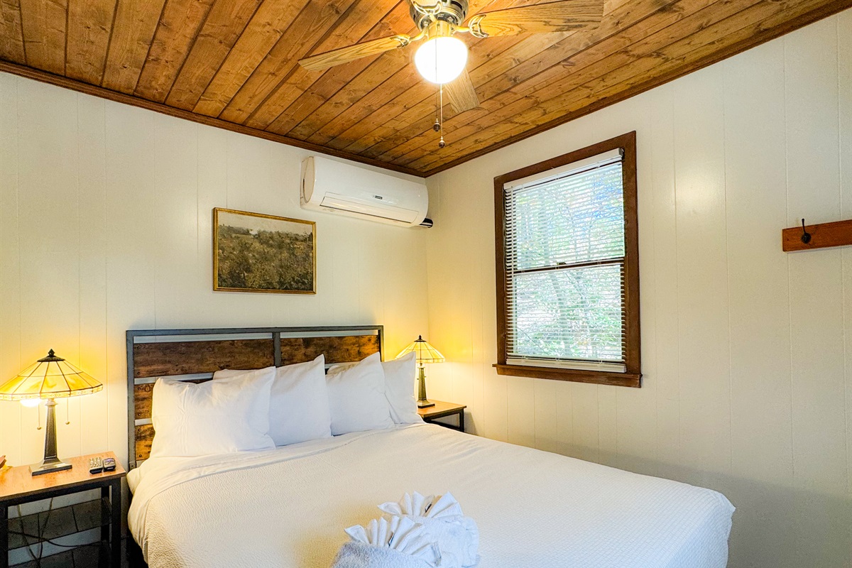 Bedroom one with a queen bed