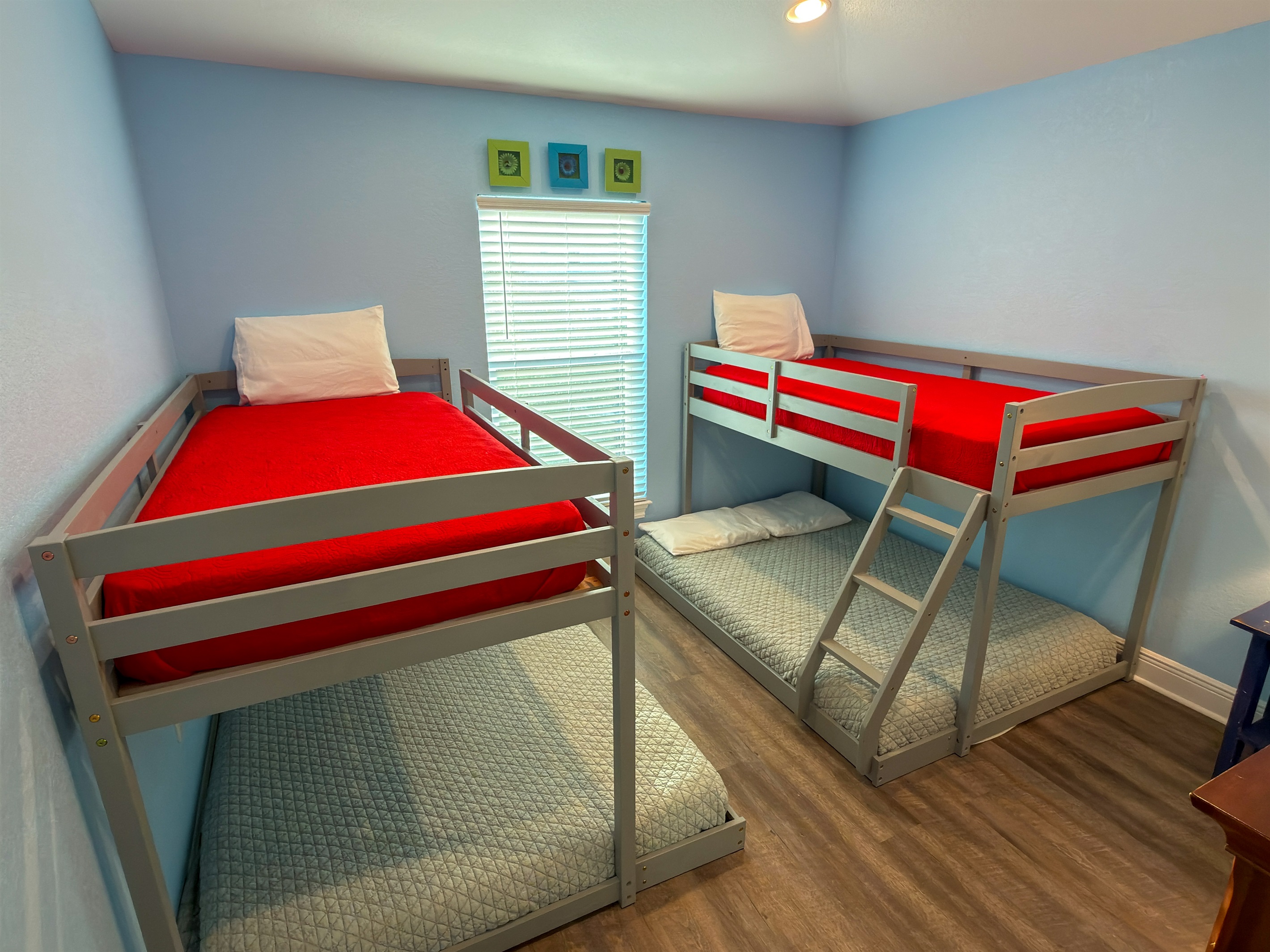 Second Floor Bunk Bedroom 4 is designed with younger guests and groups in mind, featuring two twin-over-full bunks in a bright and cheerful space.