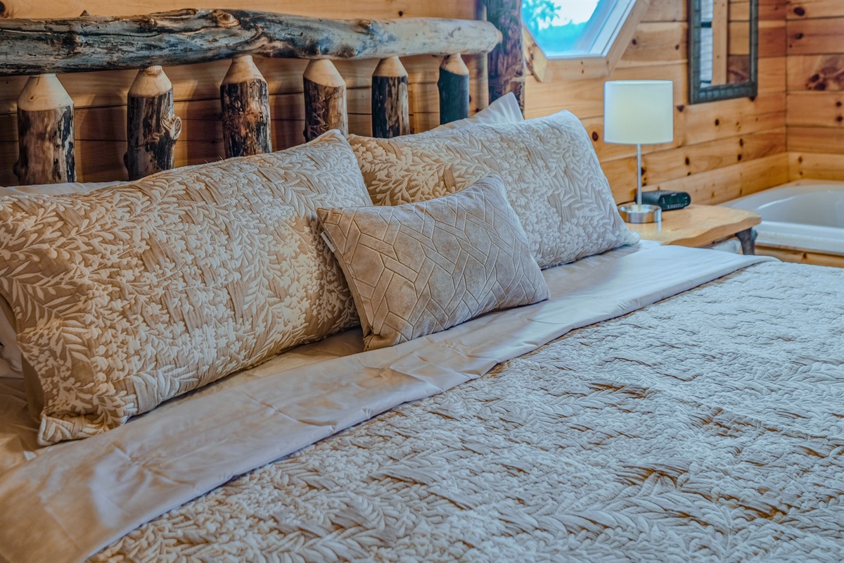 Master bedroom with traditional log king bed to give you authentic mountain cabin feel.