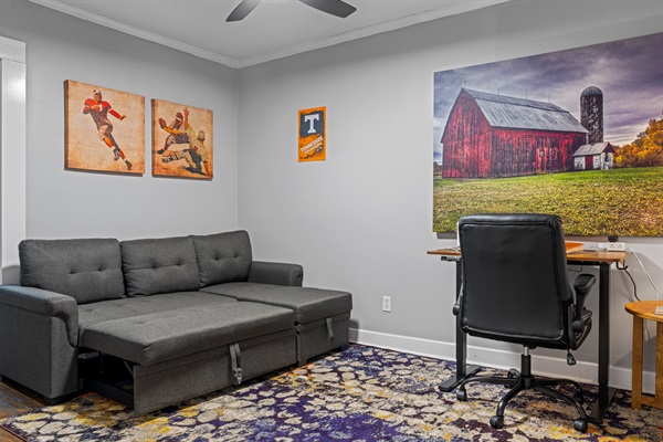 Use this stylish room as a cozy second living space or private office, complete with a sleeper sofa, TV, and comfortable workspace.