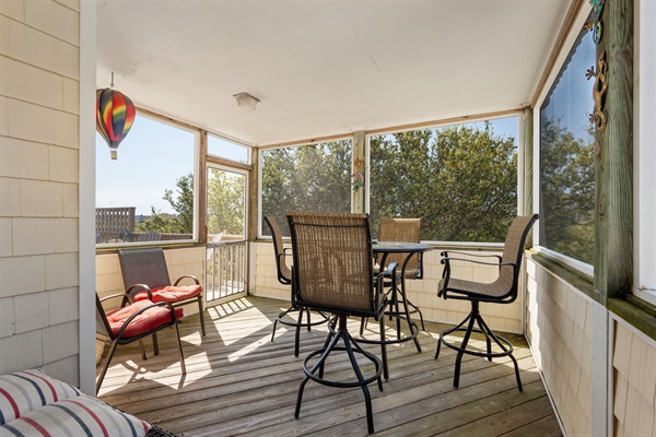 Screened porch with outside dining table for 4