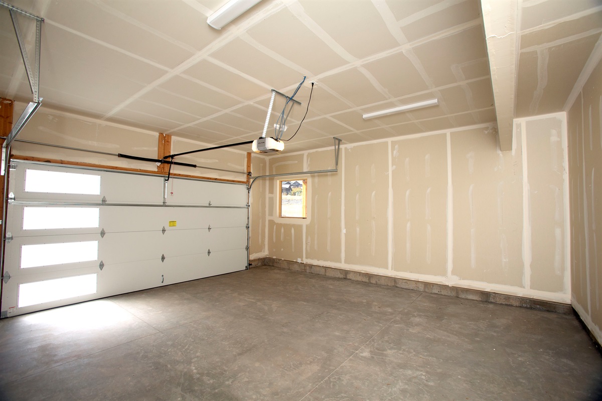 Private garage with ample space for parking and storing outdoor gear.