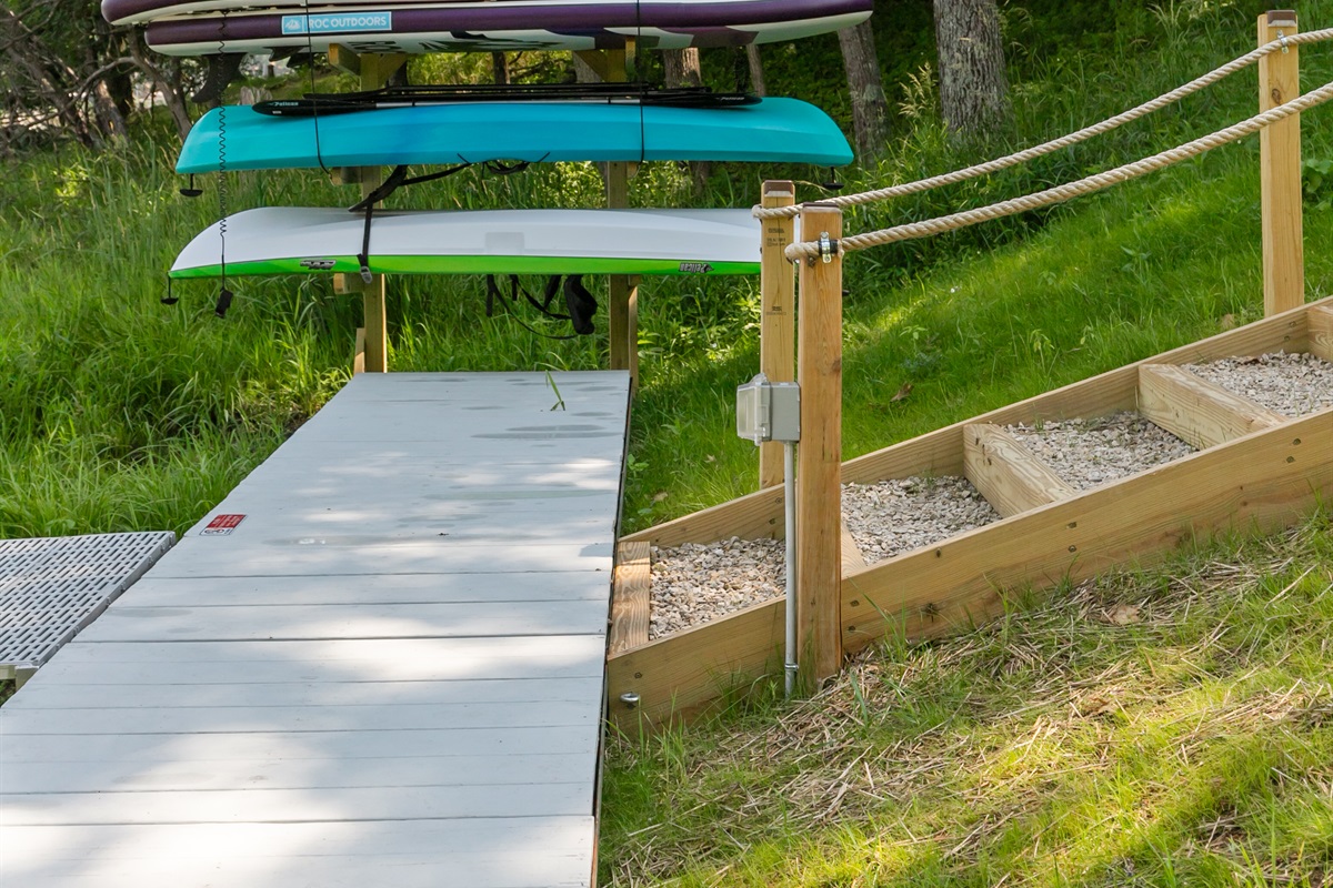 Kayaks and paddleboards are kept lakeside, ready whenever you are