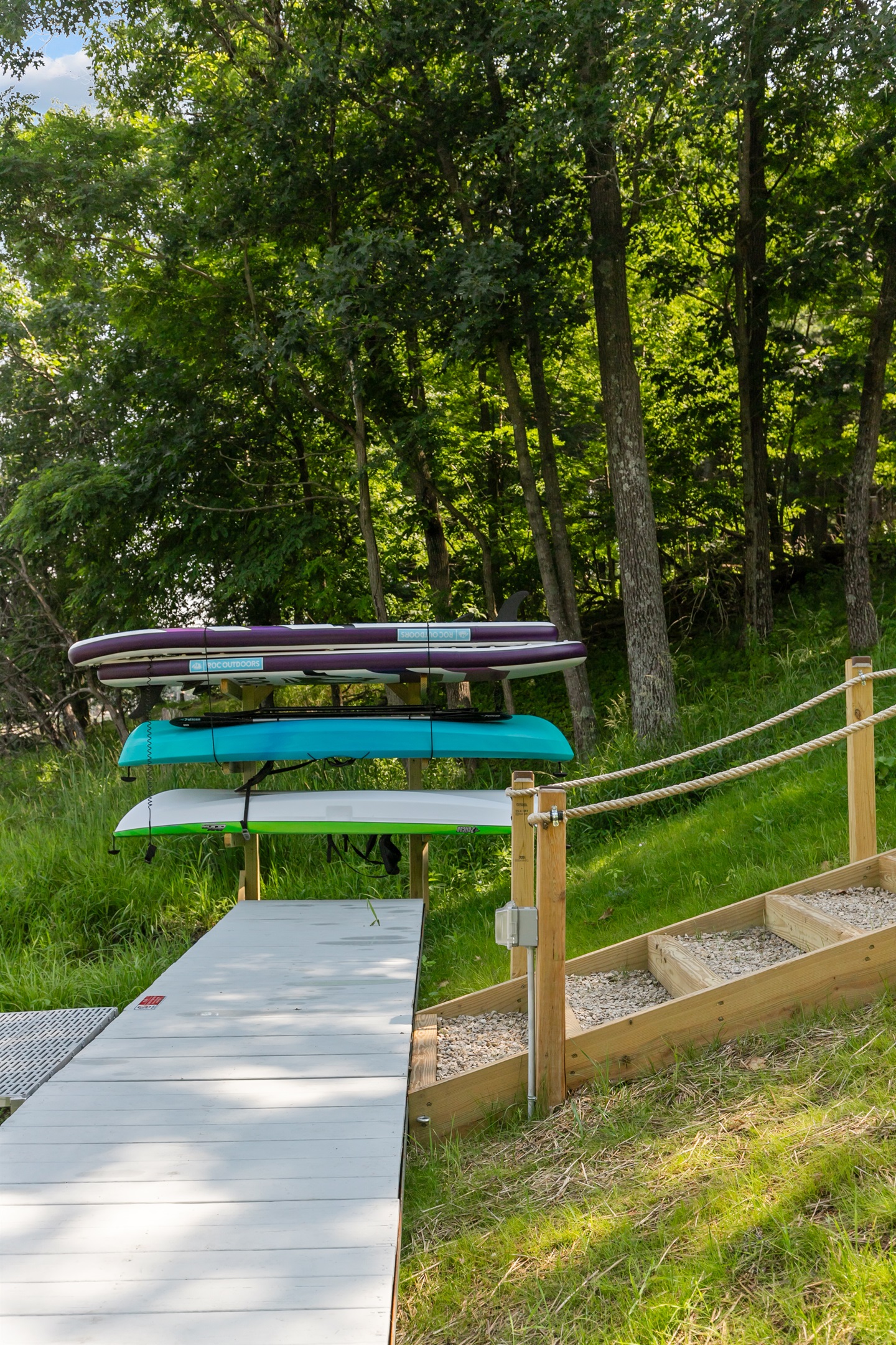 Kayaks and paddleboards are kept lakeside, ready whenever you are