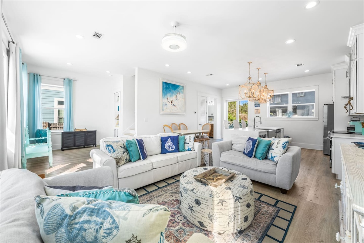 Spacious open-concept living!  Relax on plush, comfortable couches or enjoy a family meal in the sun-drenched dining area. This airy first floor is designed for seamless entertaining and coastal comfort—the heart of your Blue Mountain getaway.