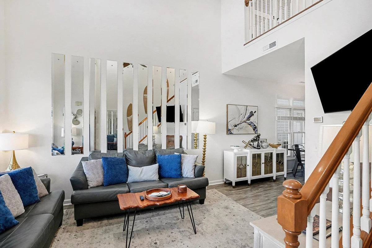 Two-story great room with soaring ceilings and room for the whole crew to gather