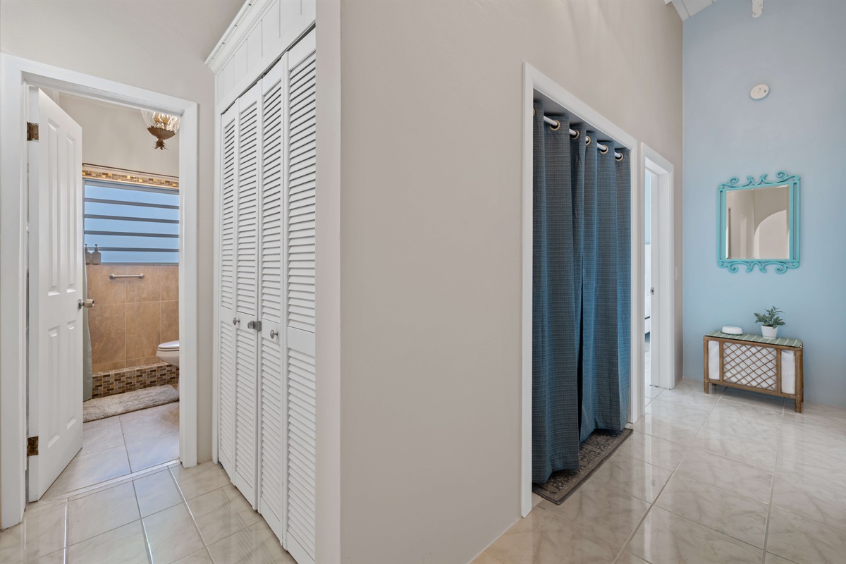 The guest bathroom and laundry sit in the main hallway between the two guest bedrooms. This bathroom is shared between the two guest bedrooms.
