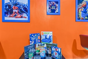 A playful oasis filled with bright orange hues and exciting entertainment options, from pool, airhockey, beerpong and foosball to arcade classics, making this the ultimate spot to unwind and have fun.