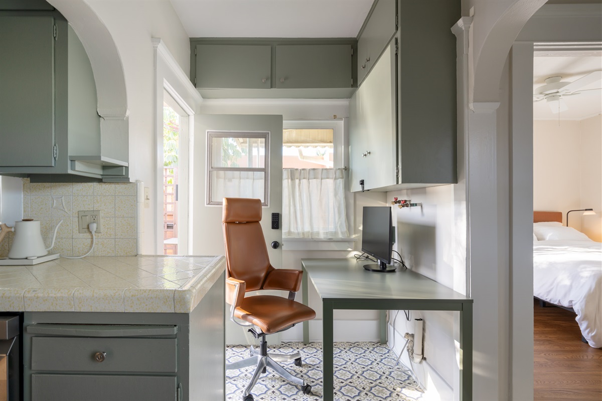 The main work area is just off the kitchen and has great light.