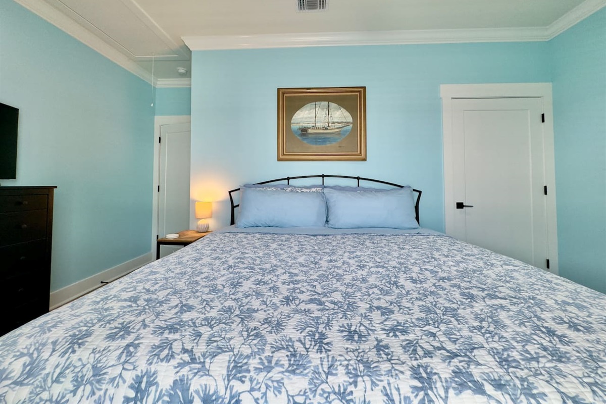 This welcoming bedroom offers comfort, light, and simplicity.