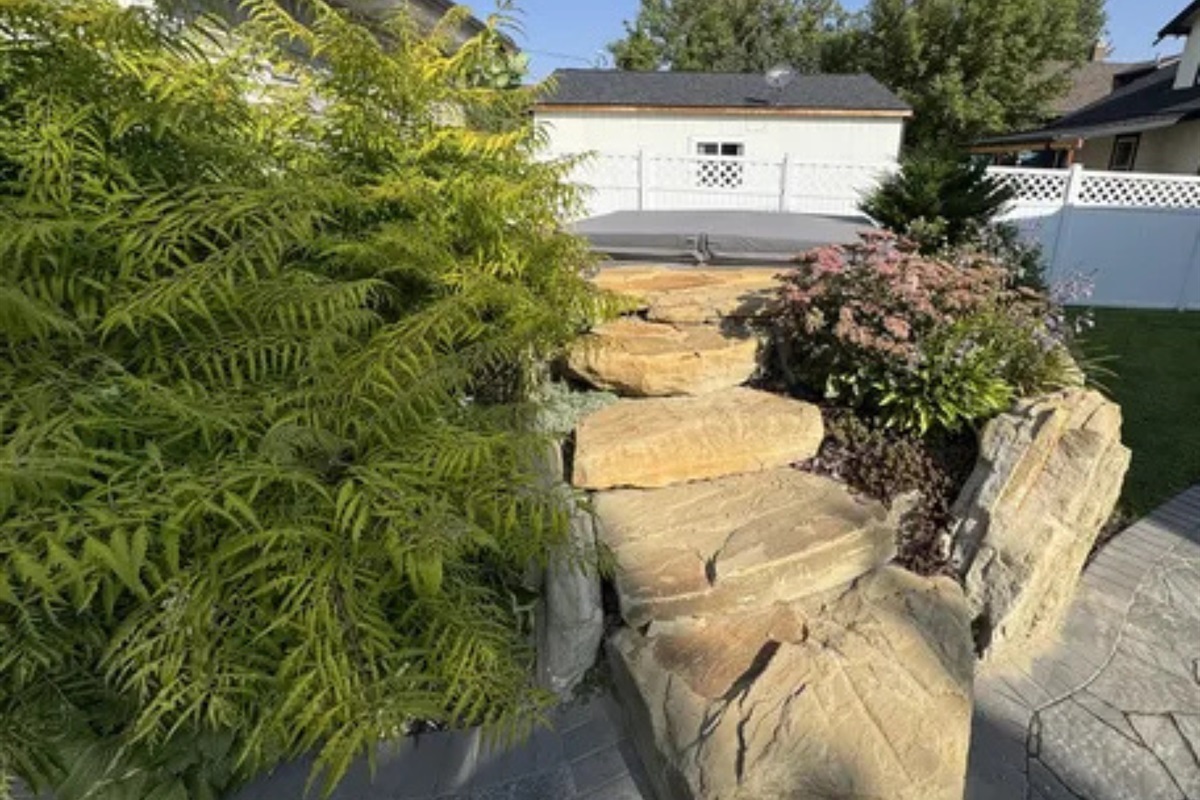 This outdoor path adds so much charm with its greenery, stonework, and garden feel.